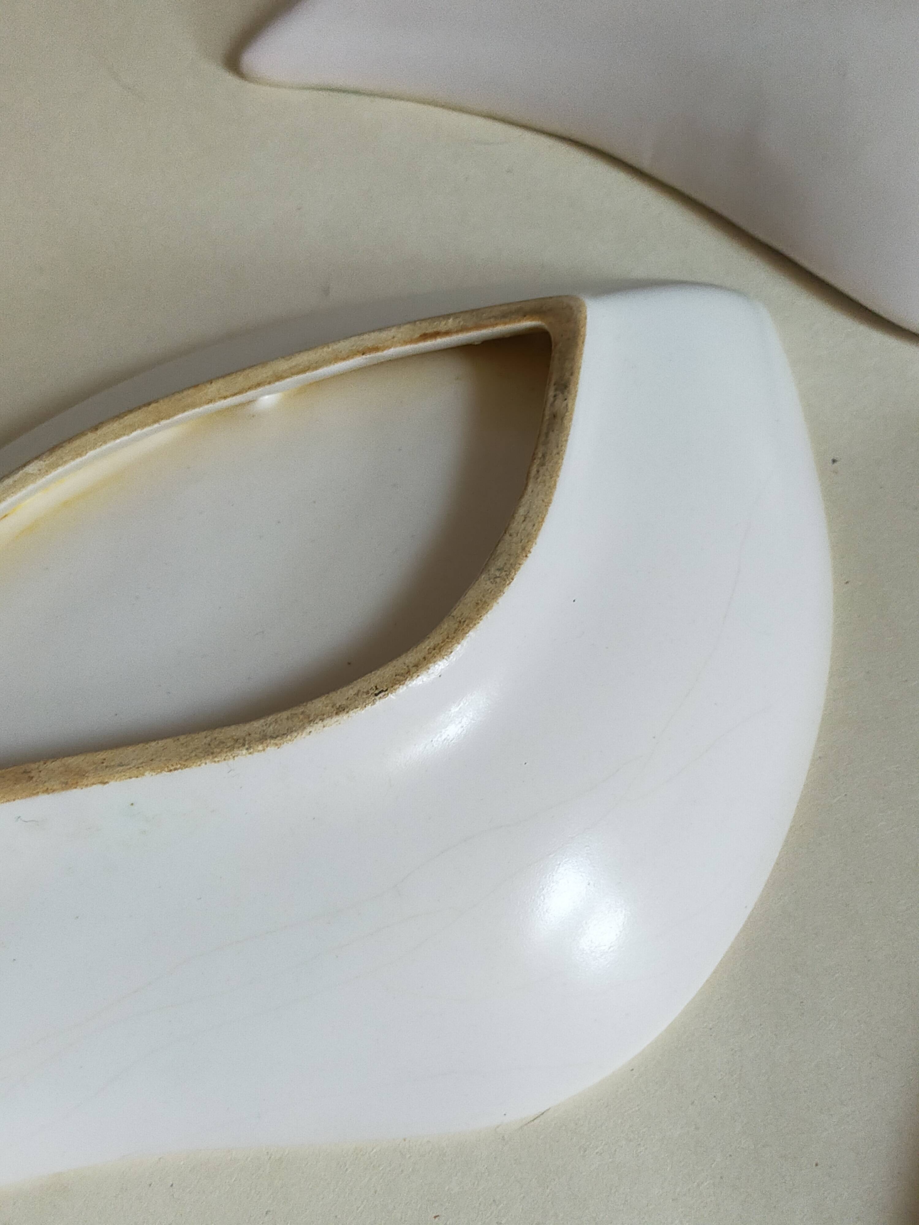 Three vintage free-form ceramic ravine dishes from the 1950s