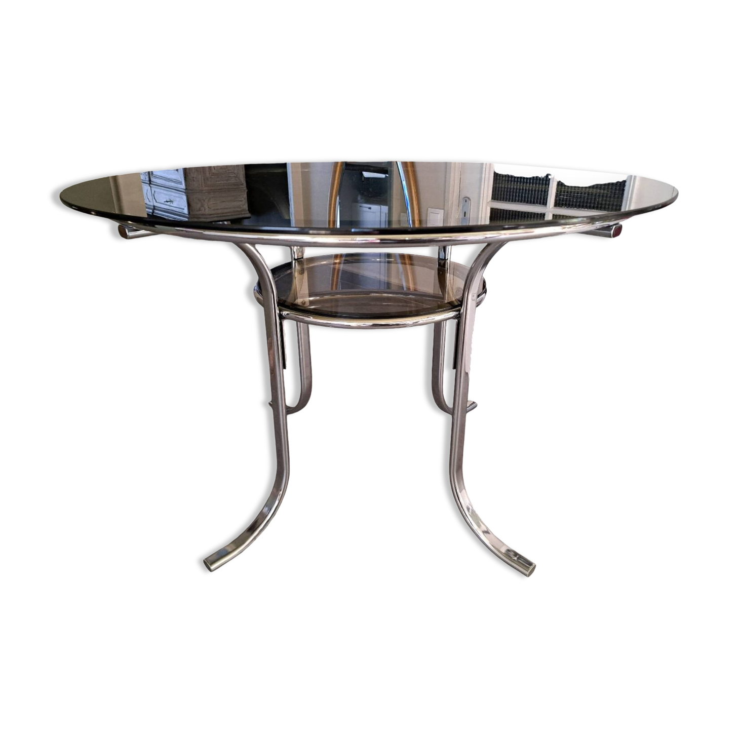 Round table in chromed metal and smoked glass