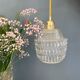 Suspension globe vintage en verre moulé transparent