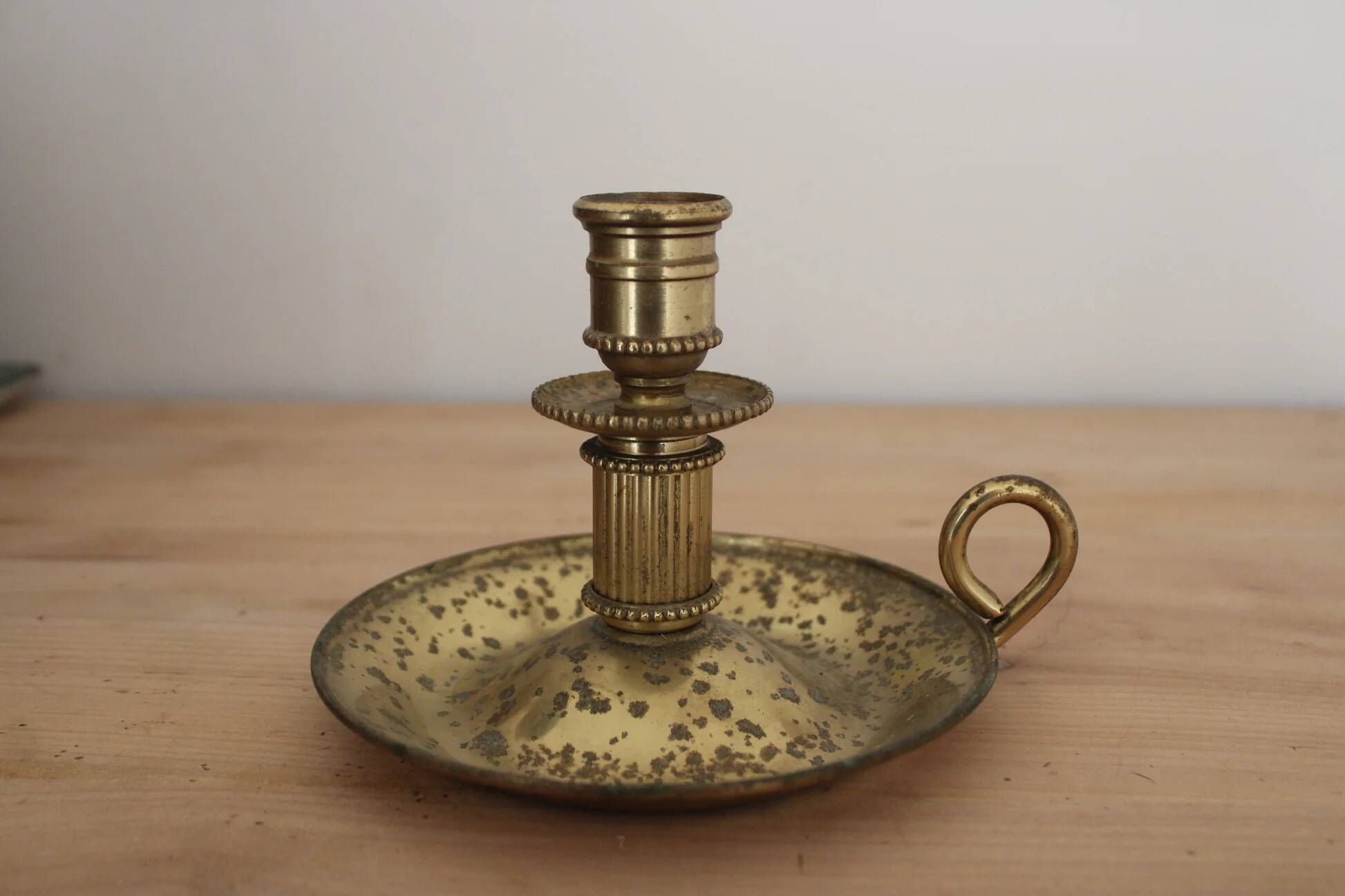 Antique brass hand candlestick – Columned fluted cellar rat