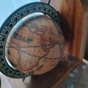 Pair of vintage bookends with rotating terrestrial globes on wooden bases in Spain