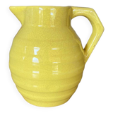 Old yellow ceramic pitcher