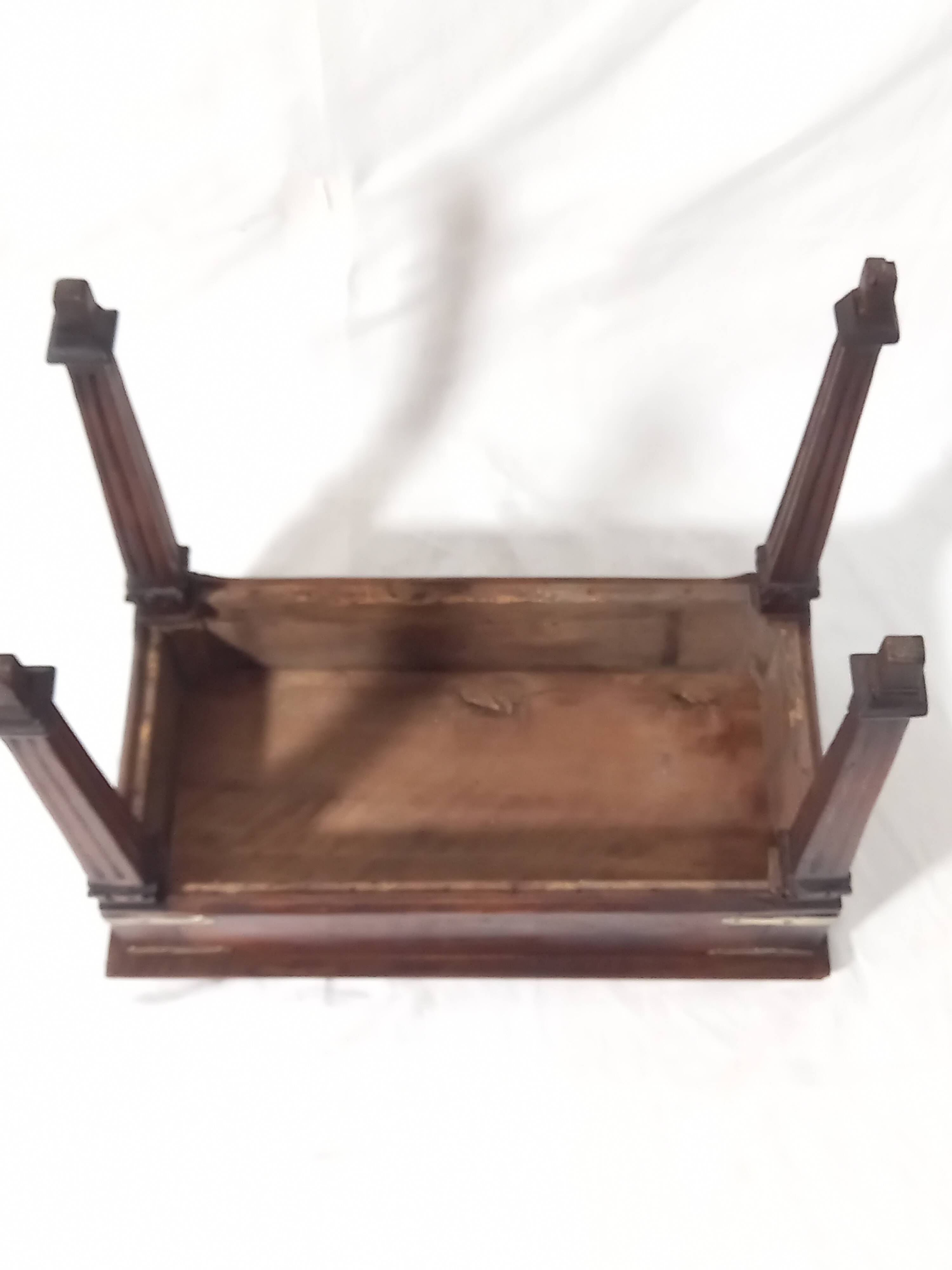 Small old side table with brass finishes