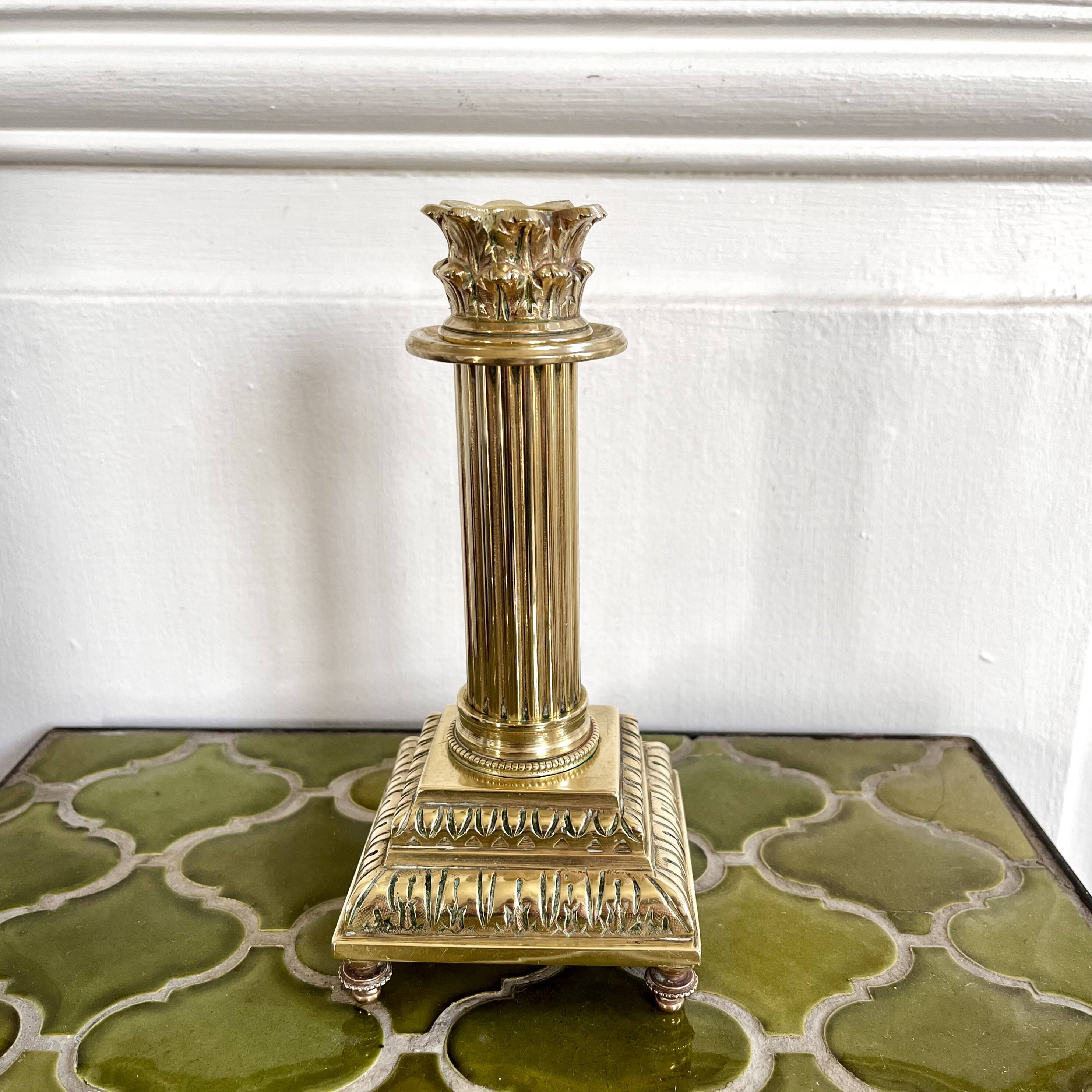 Empire style gold candle holder
