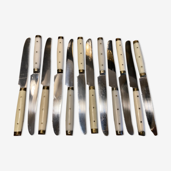 Set of 12 white Pradel knives