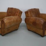 Pair of French club chairs with moustache back in cognac leather, 1940s