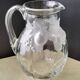 Large water jug with embossed fruit decoration in frosted glass