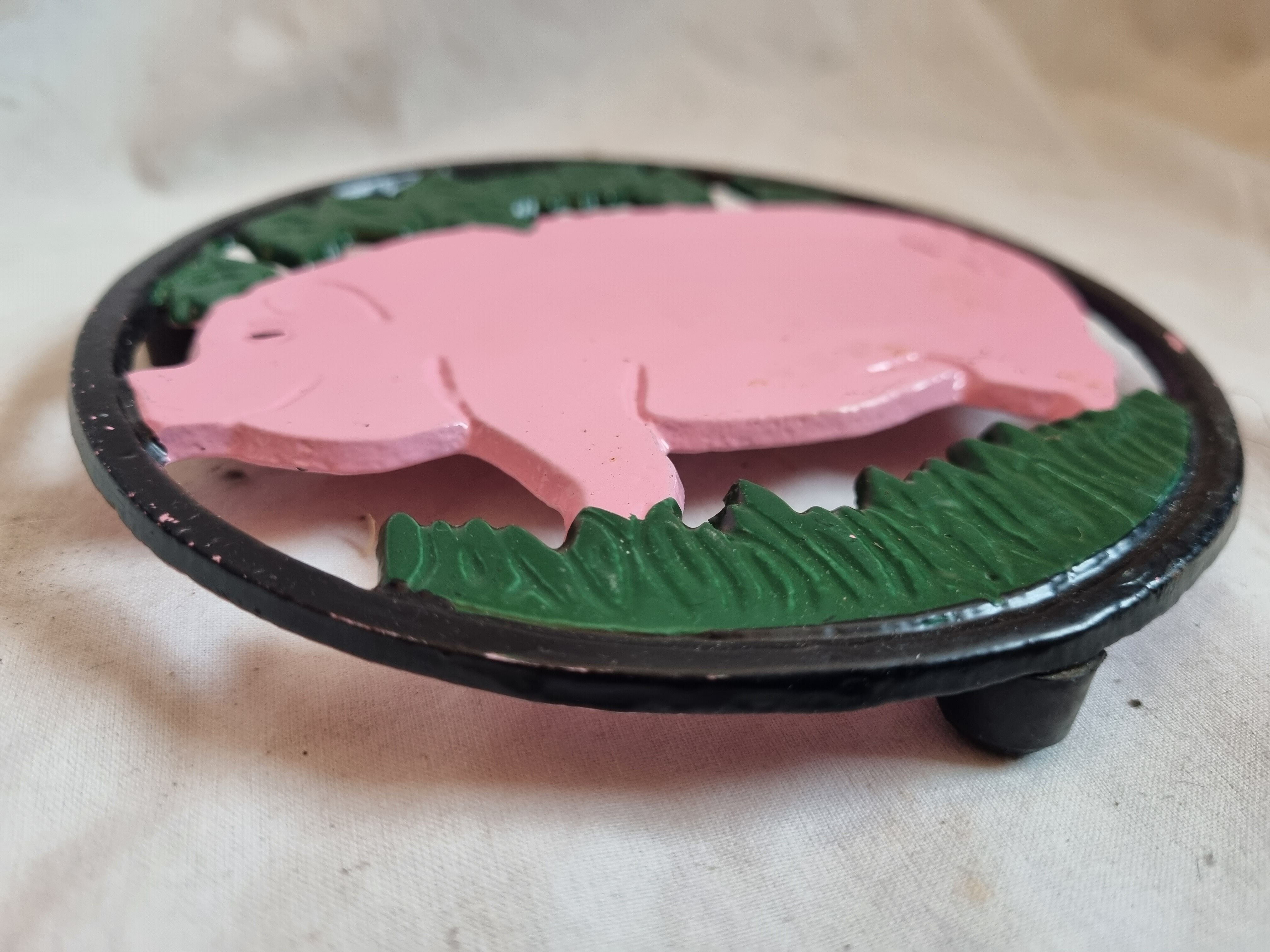 Cast iron underside, pink pig