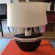 Table lamp in black and pink stone marquetry with a silk shade.