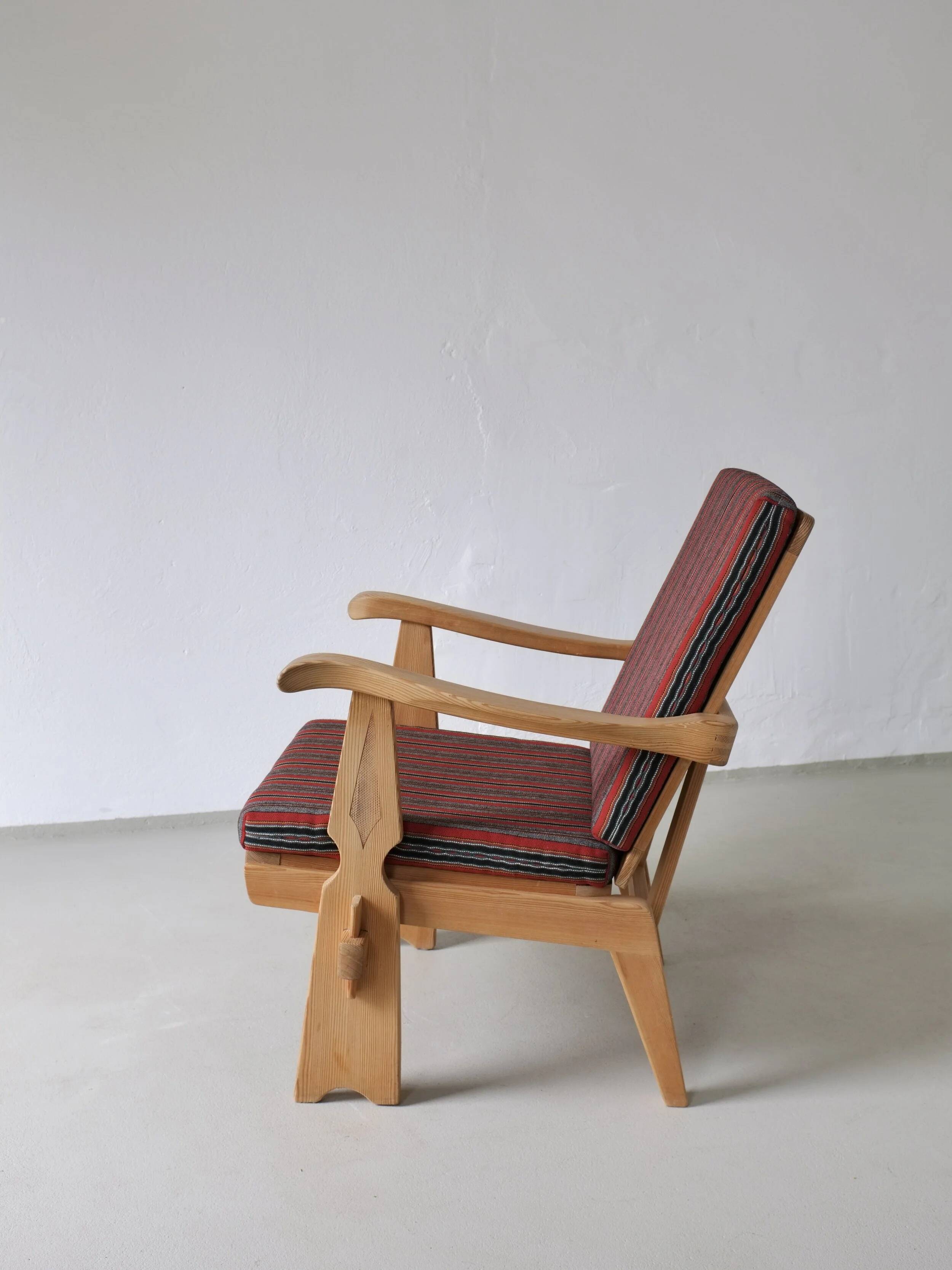 2 carved pine lounge chairs | Scandinavia | 1970s