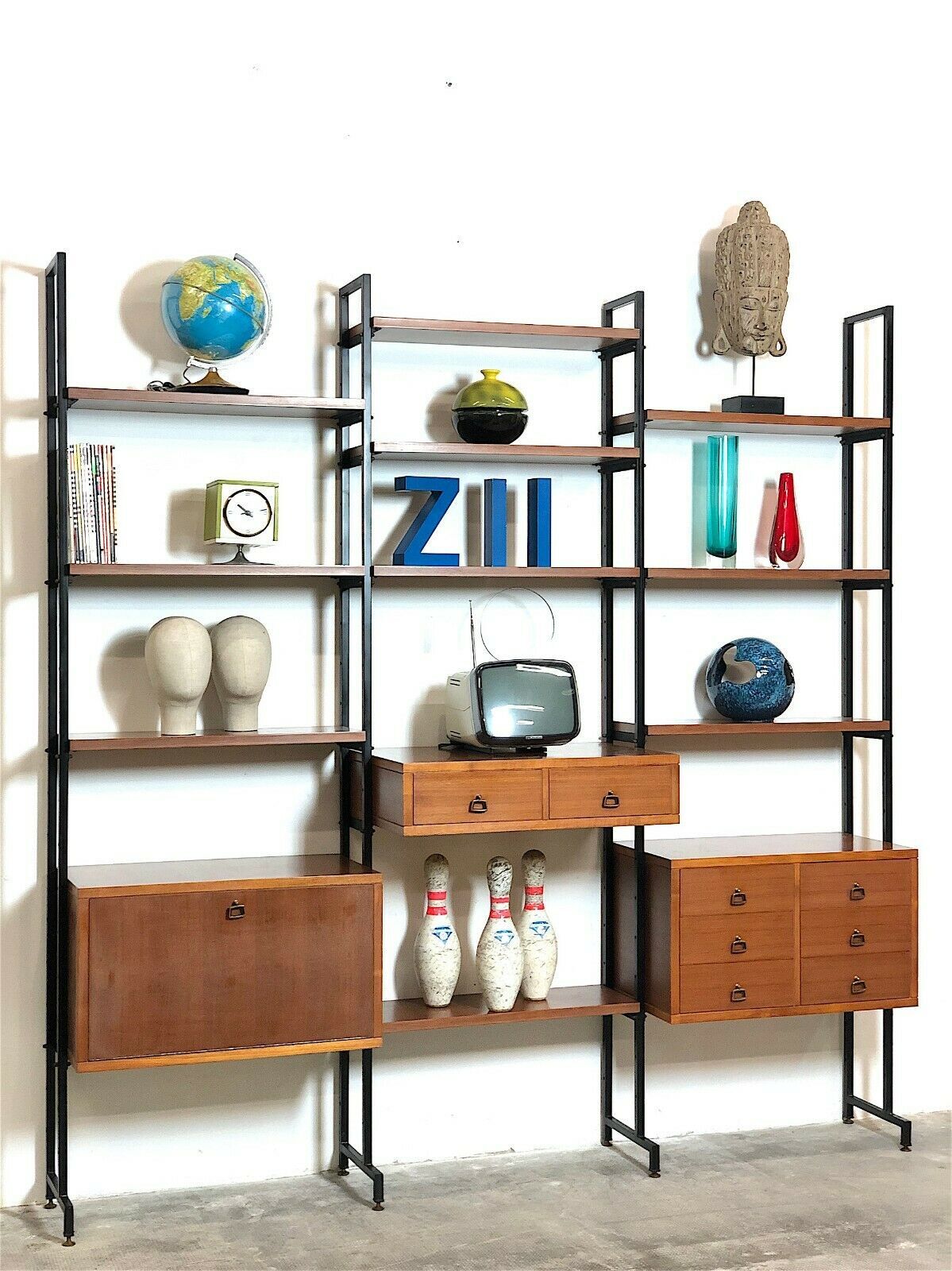 Modular storage unit and teak bookcase. Italy, 60s