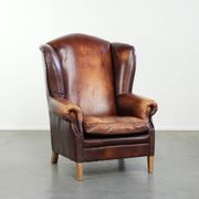 Fauteuil à oreilles en cuir de vache confortable dans le style anglais