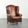 Fauteuil à oreilles en cuir de vache confortable dans le style anglais