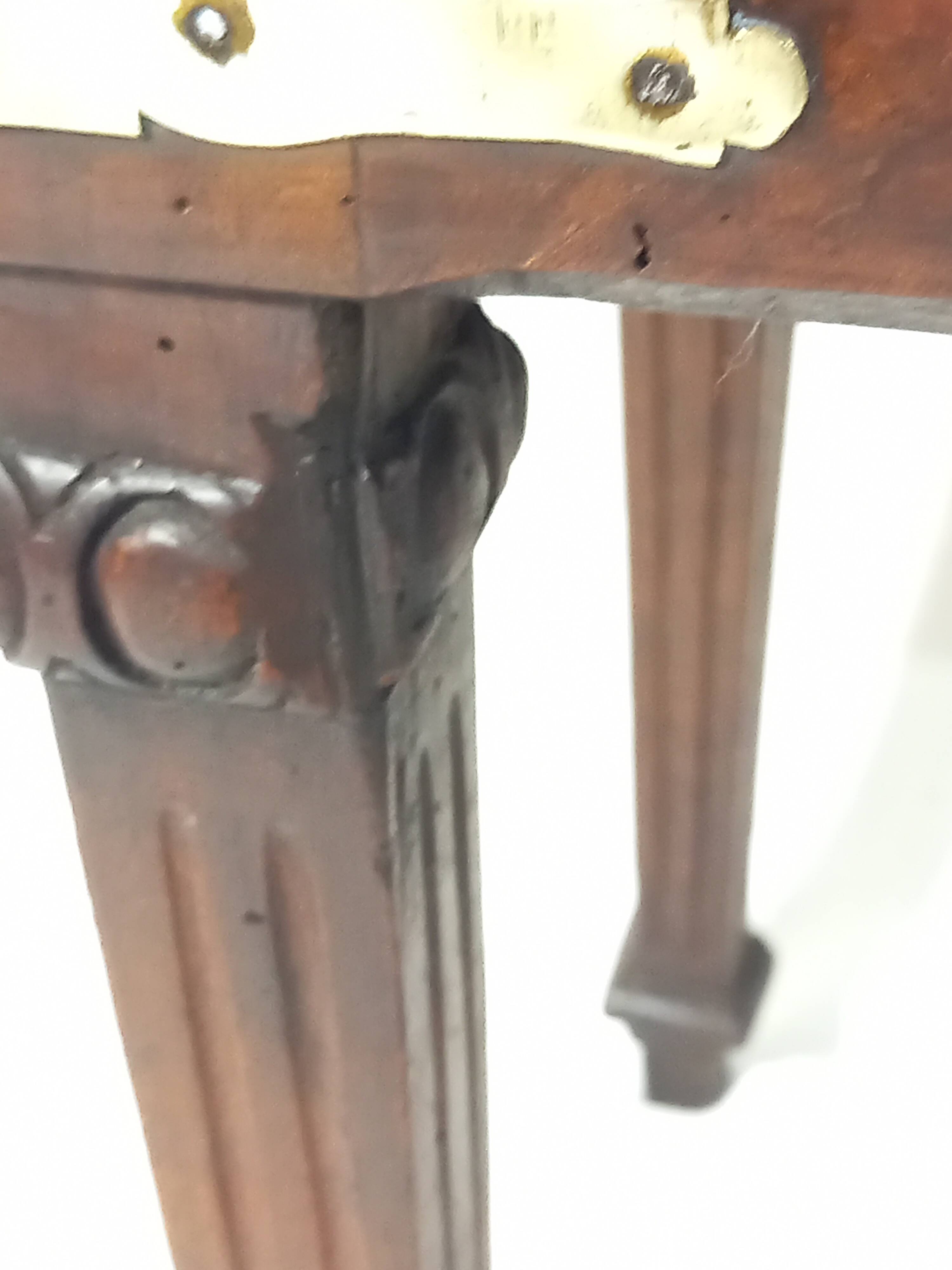 Small old side table with brass finishes