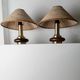 Lot of 2 vintage table lamps from the 1970s, dark wood oval bases with curved brass details, handmade natural fibre lampshades, elegant lighting.