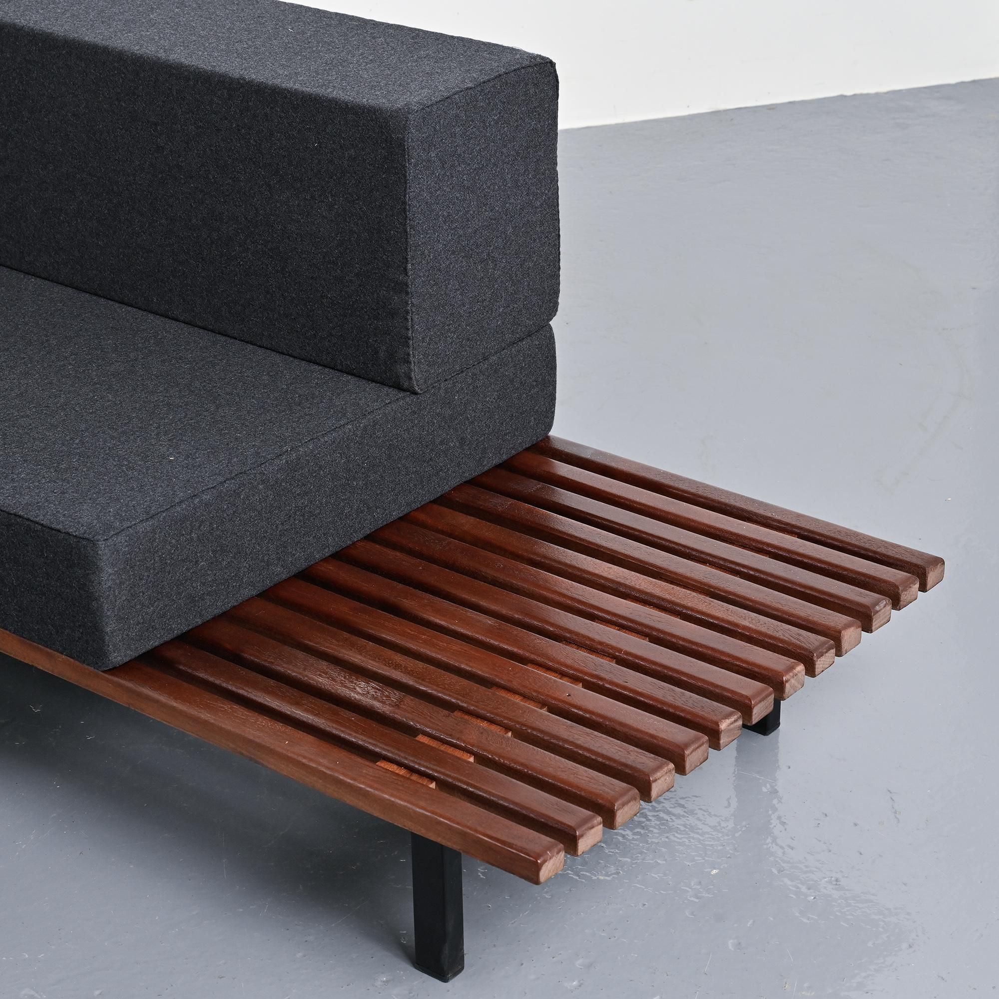 Cansado bench in mahogany by Charlotte Perriand, circa 1962.