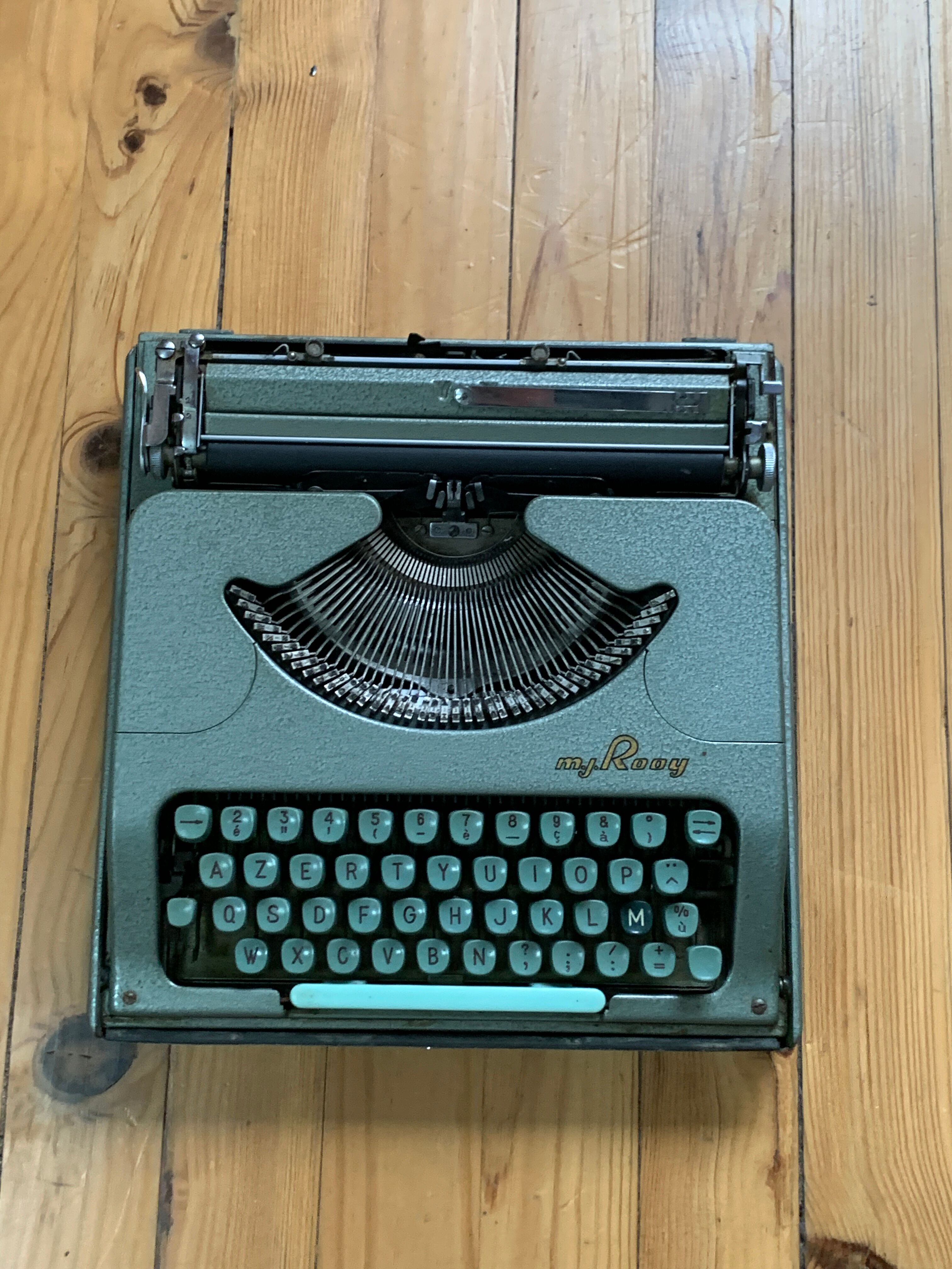M.J. Rooy light green typewriter