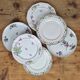 Composition of 6 flat plates in Limoges porcelain: