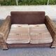 Exotic 2-seater sofa in woven banana tree / rattan and brown fabric.