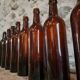 Set of 10 bottles of old Bordeaux French wine in ruby brown glass, 19th century.