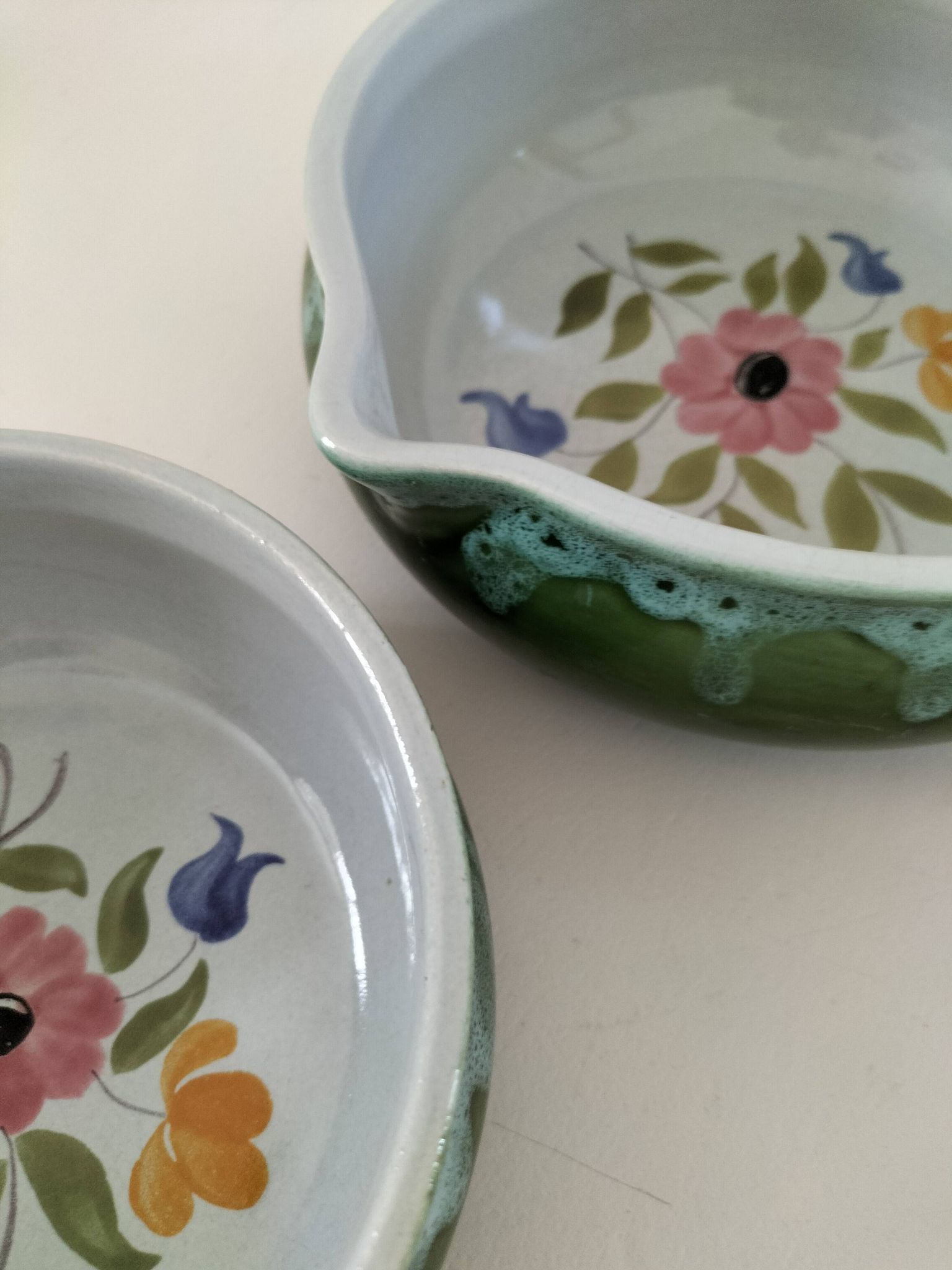 Duo of flowery caquelons