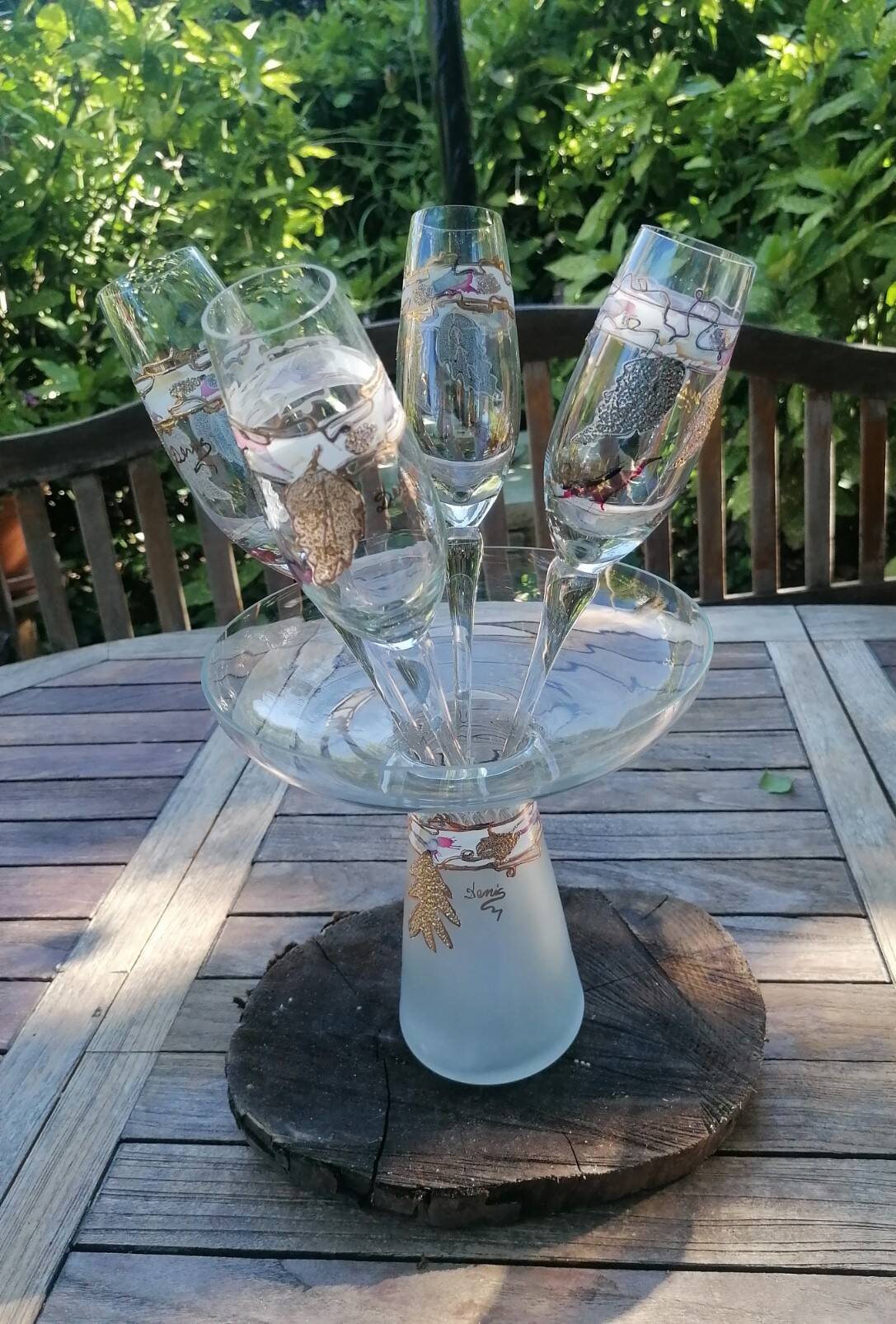 Set of 4 painted blown glass champagne flutes. Signed Denis.