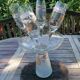 Set of 4 painted blown glass champagne flutes. Signed Denis.