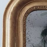 Old gilded mirror and old mercury glass - wall mirror with gold leaf