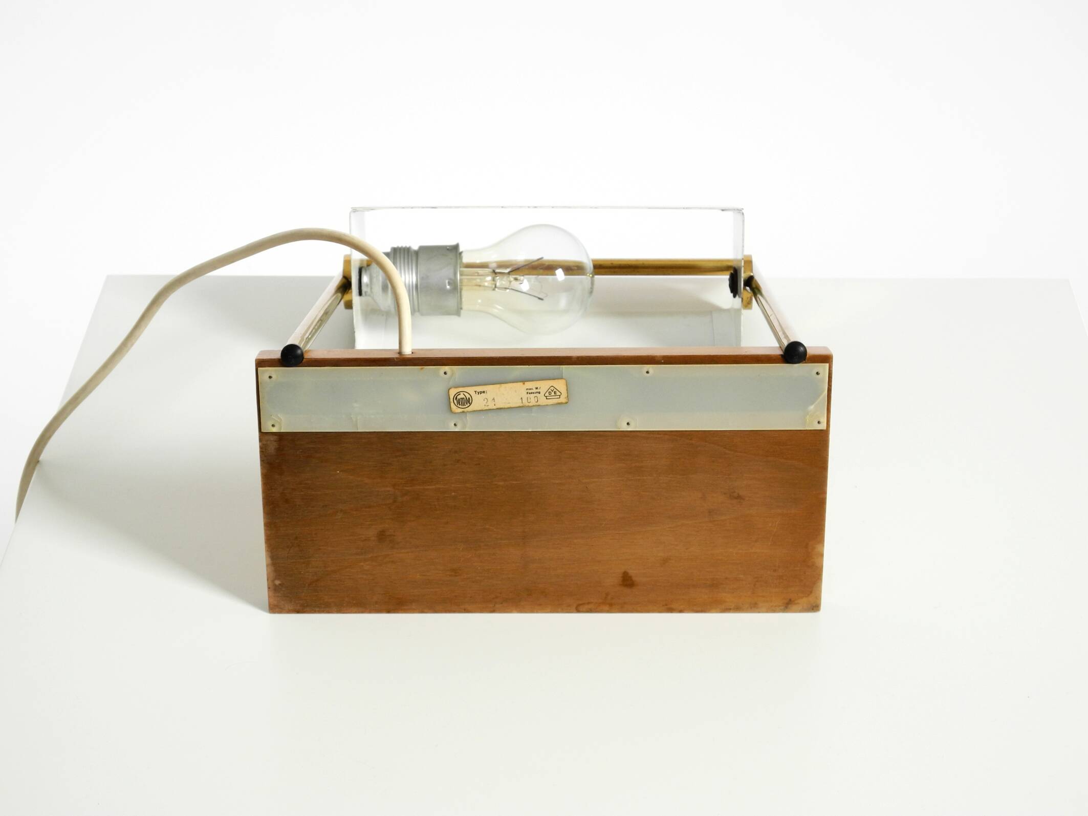 1960s Temde table lamp with a brass frame, teak base, and green lampshade