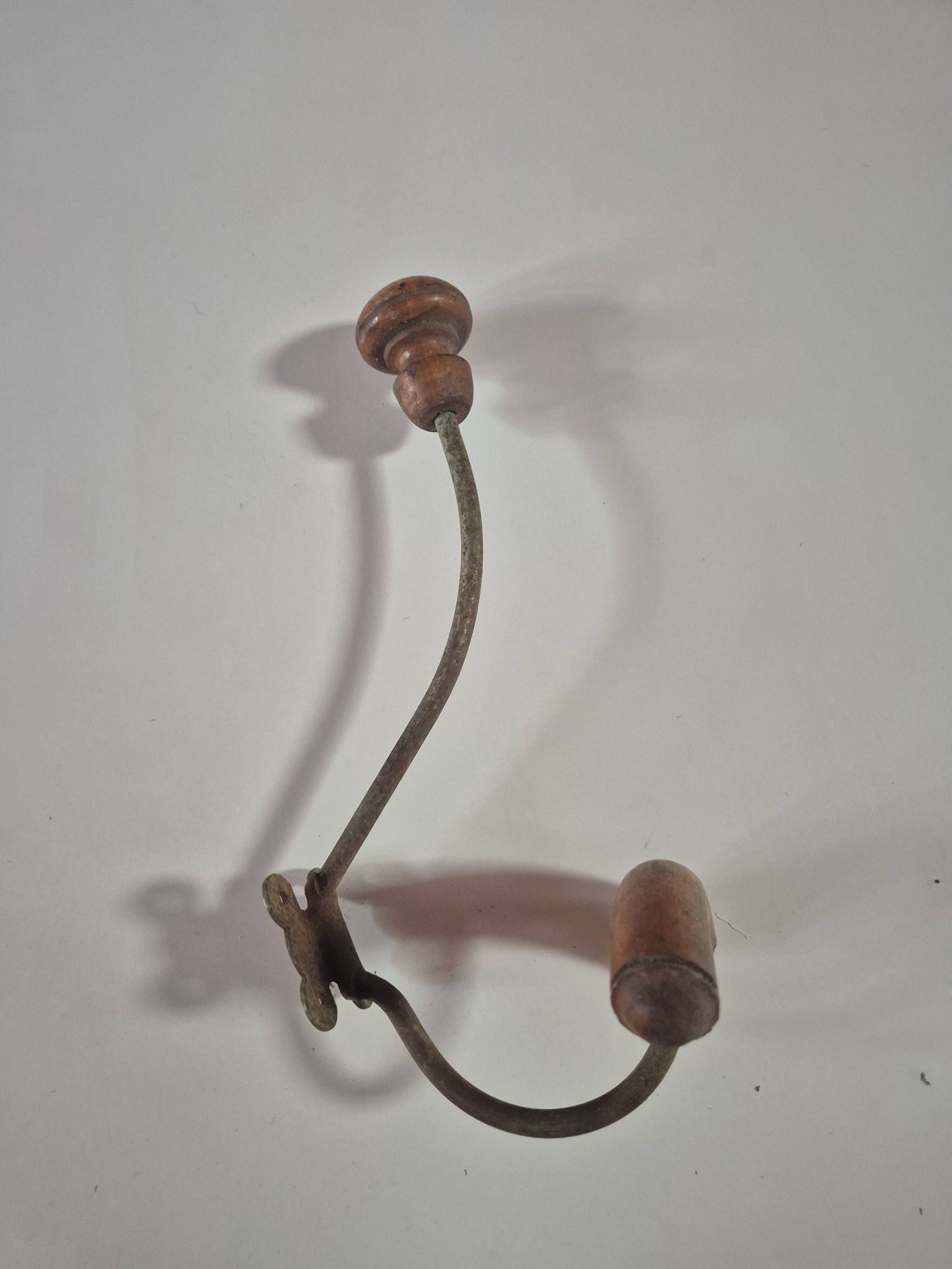 Vintage 1960s wall coat rack in wood and metal.