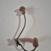 Vintage 1960s wall coat rack in wood and metal.
