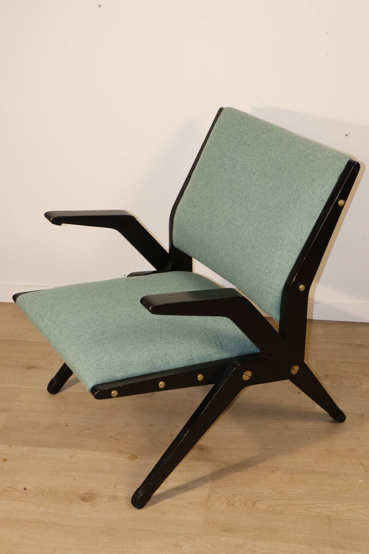 Vintage armchair from the 1960s in black wood and fabric.