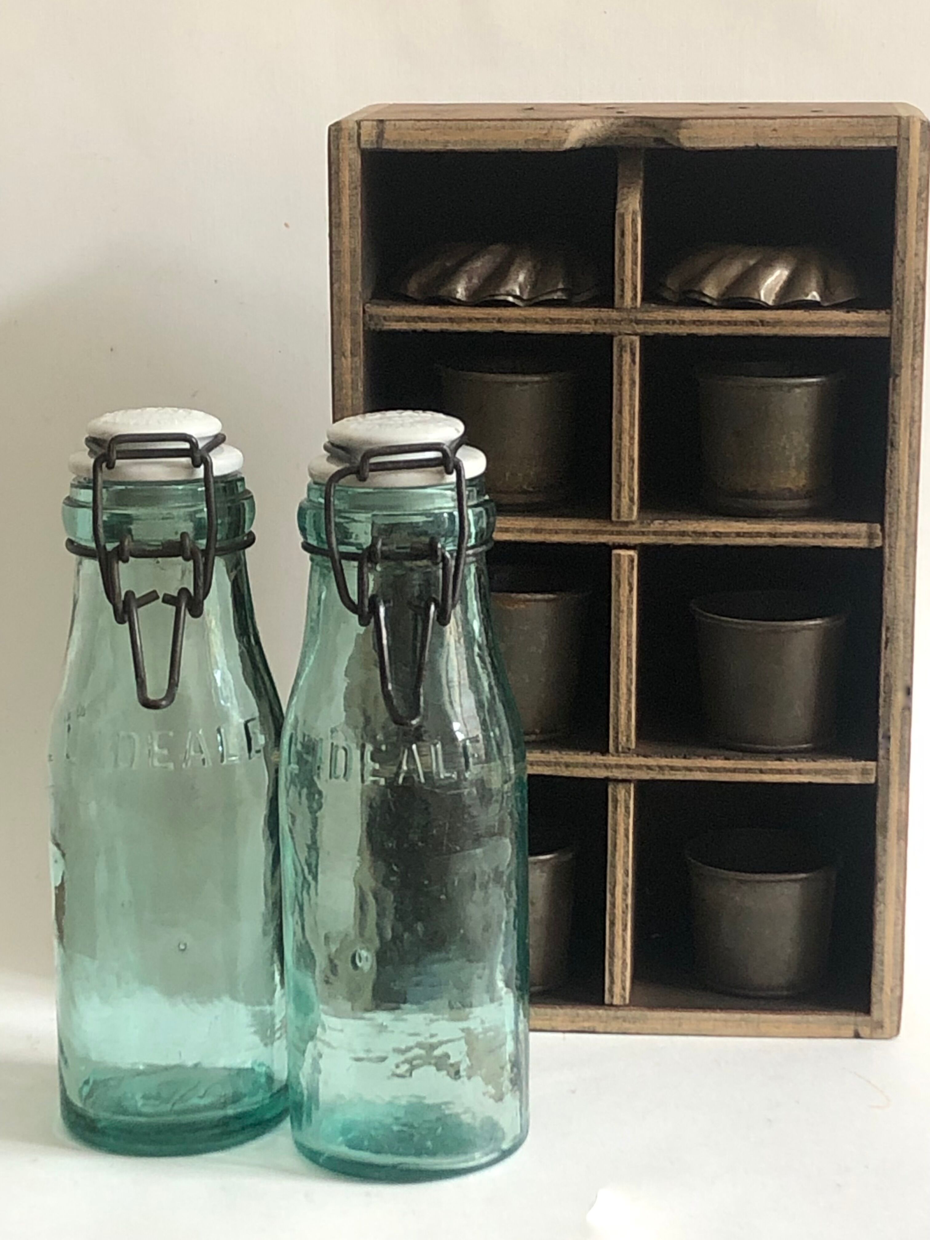 Two bottles with canned goods l'ideale