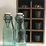 Two bottles with canned goods l'ideale