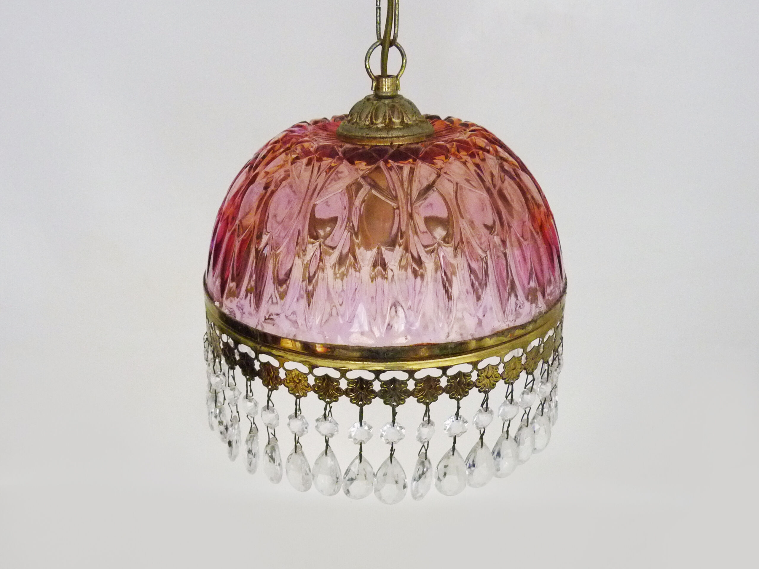 Vintage rose pendant light with pendants and patterned glass globe.