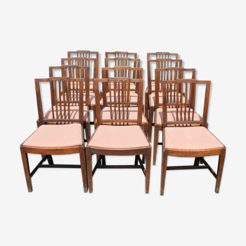 Set of 12 oak chairs with pop out seats