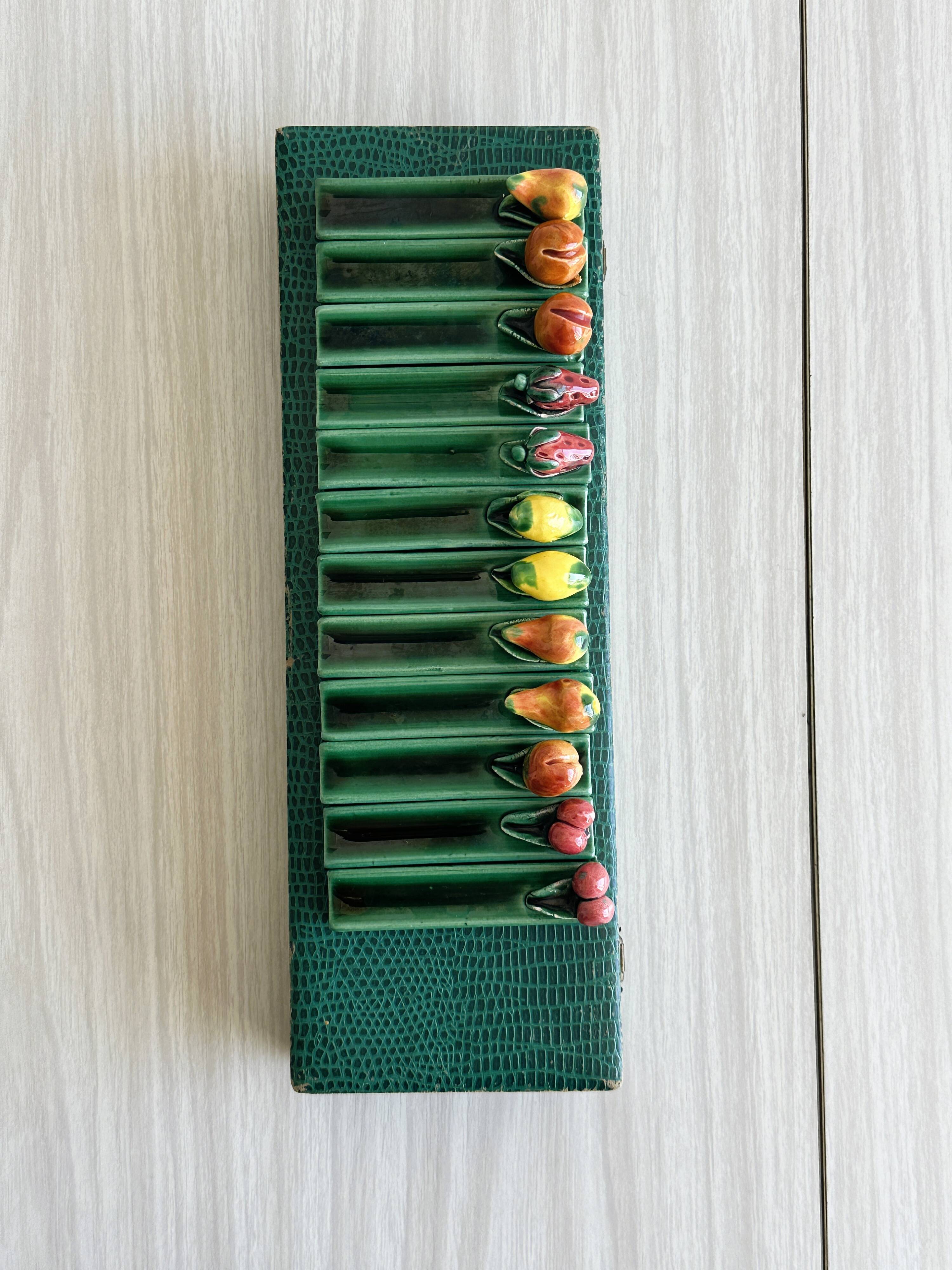 12 ceramic fruit knife holders.