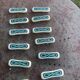 Set of 12 knife holders in green and beige glazed ceramic, slip,