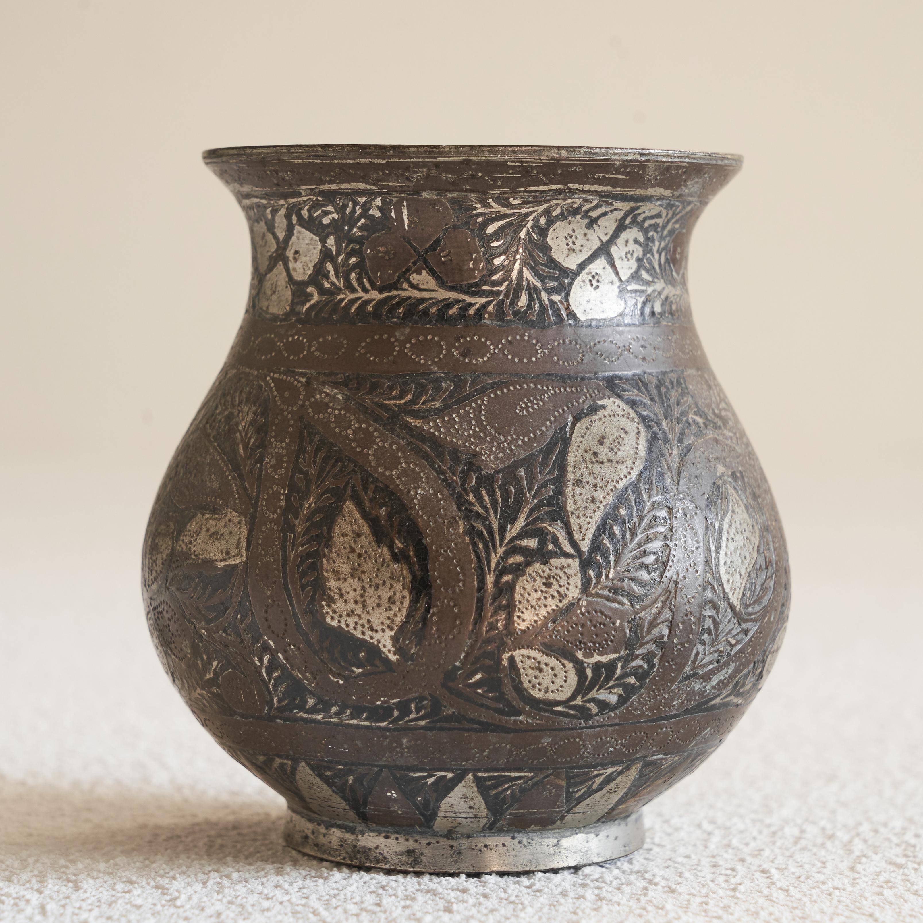 Antique pyriform Bidri vase in the shape of a pyramid.