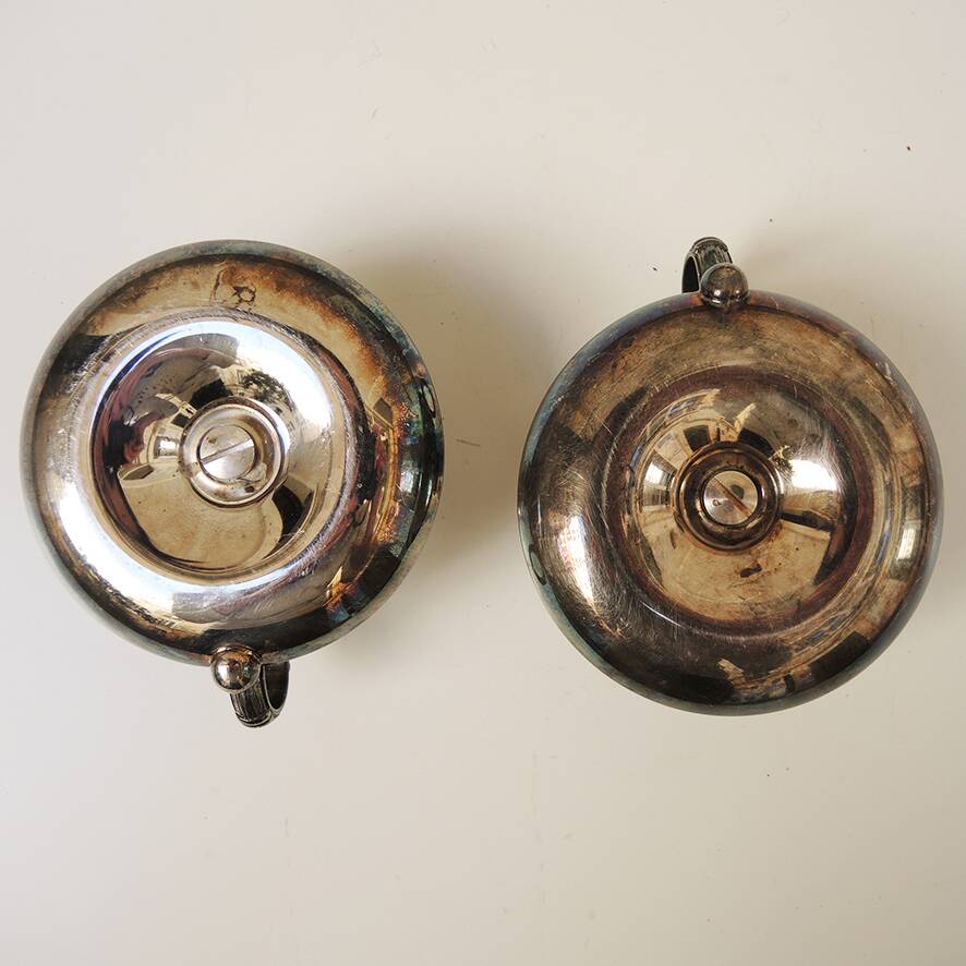 2 antique metal candlesticks with handles