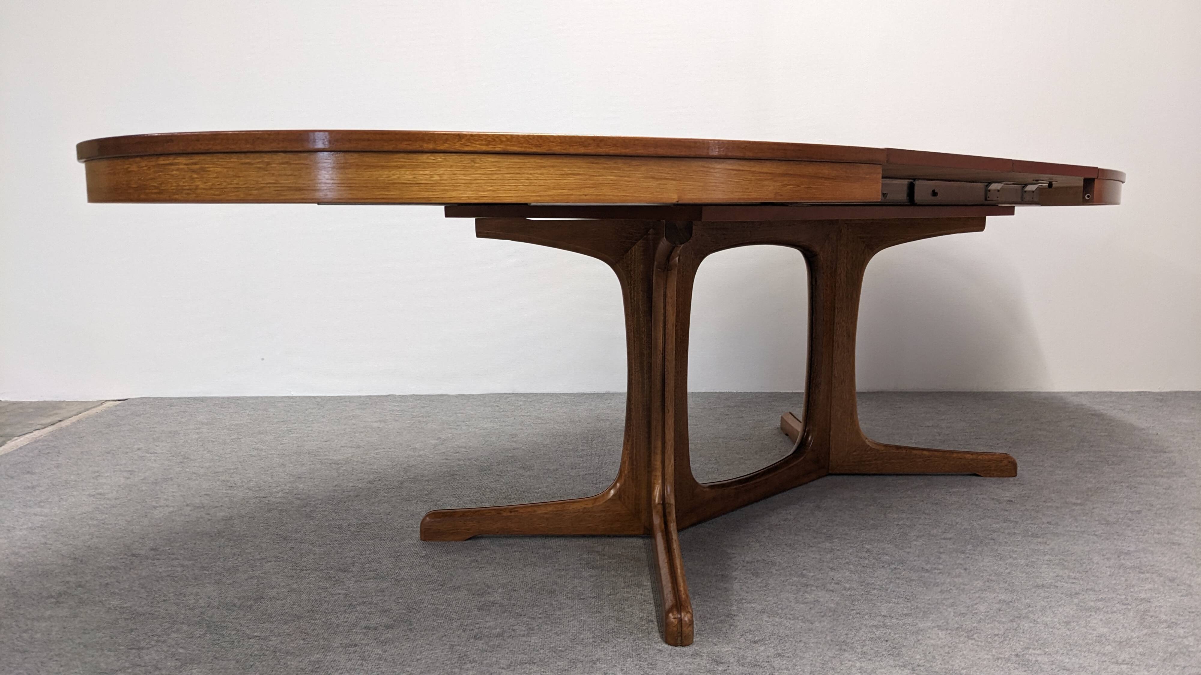 Oval extendable dining table by Baumann, France circa 1970.