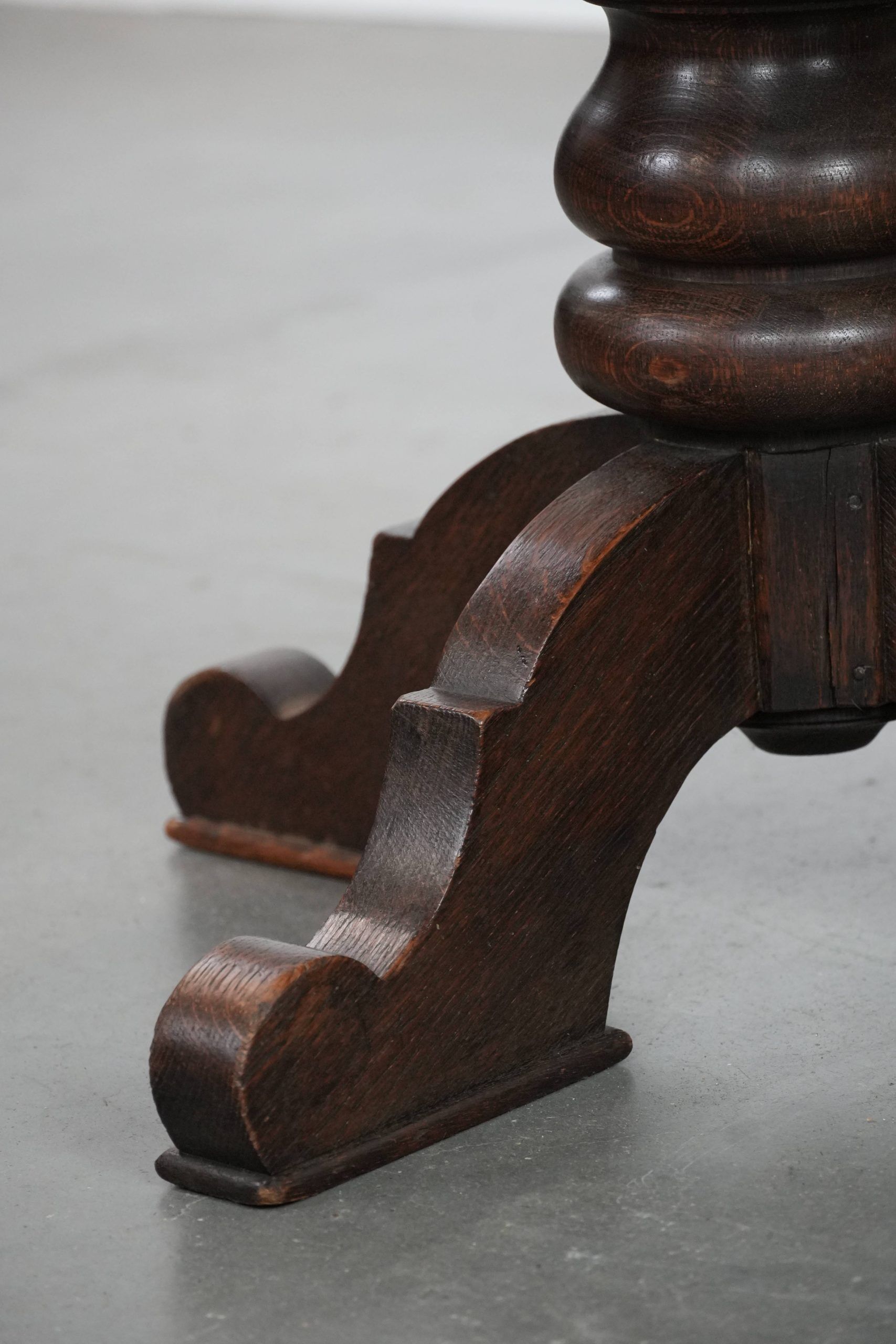 Elegant antique sheepskin leather desk chair with a heavy wooden frame