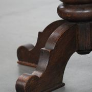 Elegant antique sheepskin leather desk chair with a heavy wooden frame