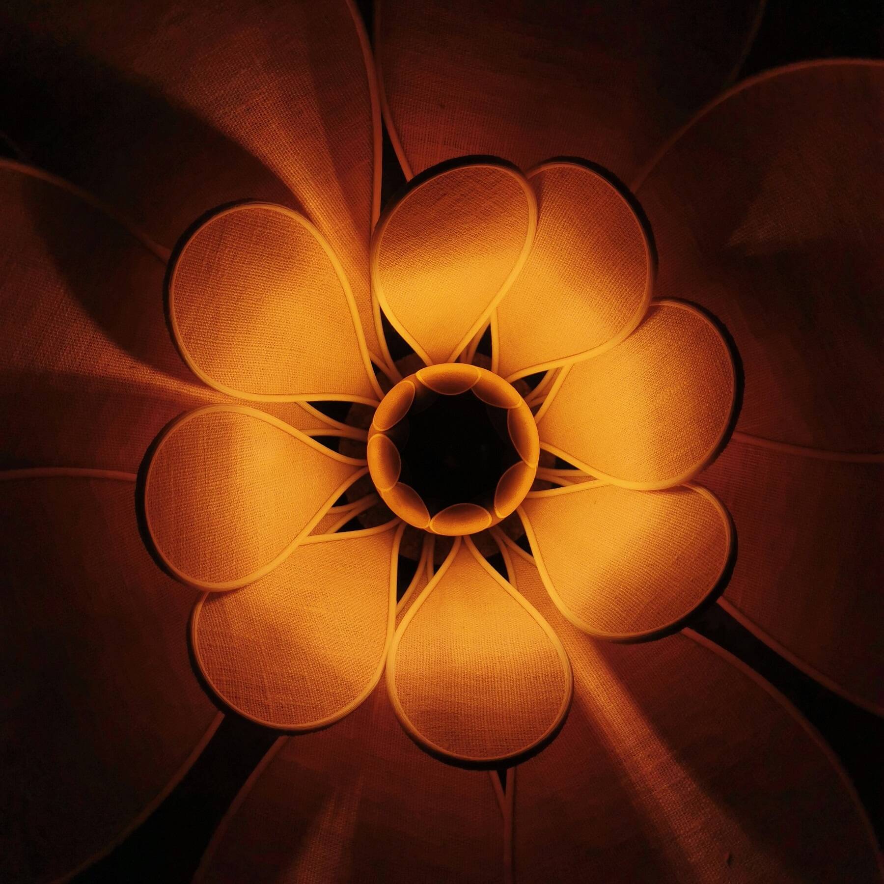 Flower wall light made of rattan and old pink linen petals