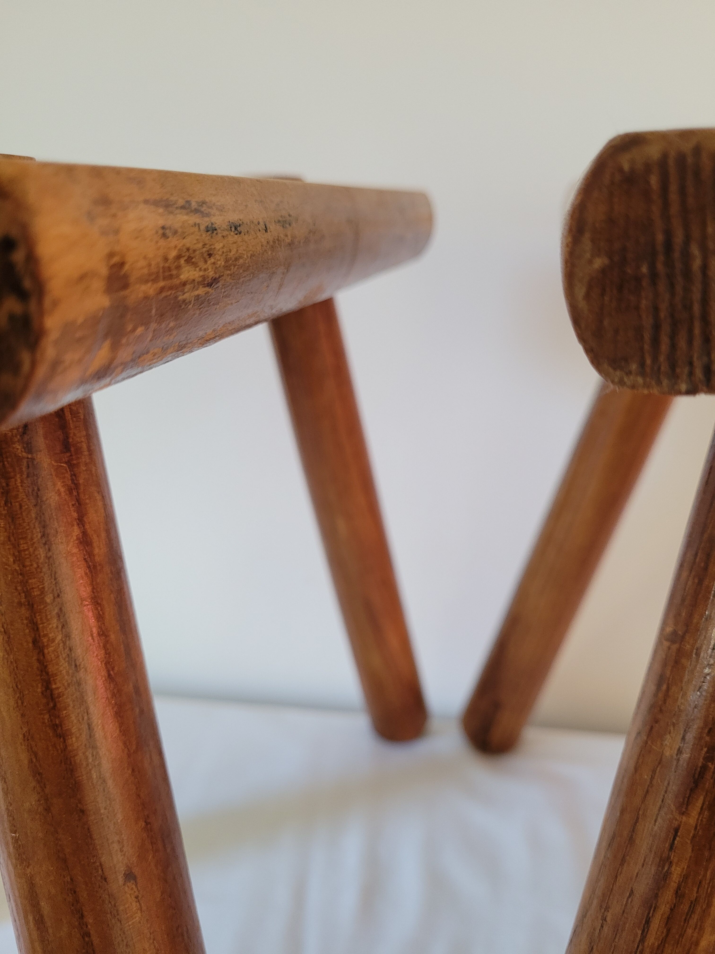 Pair of half-moon tripod stools