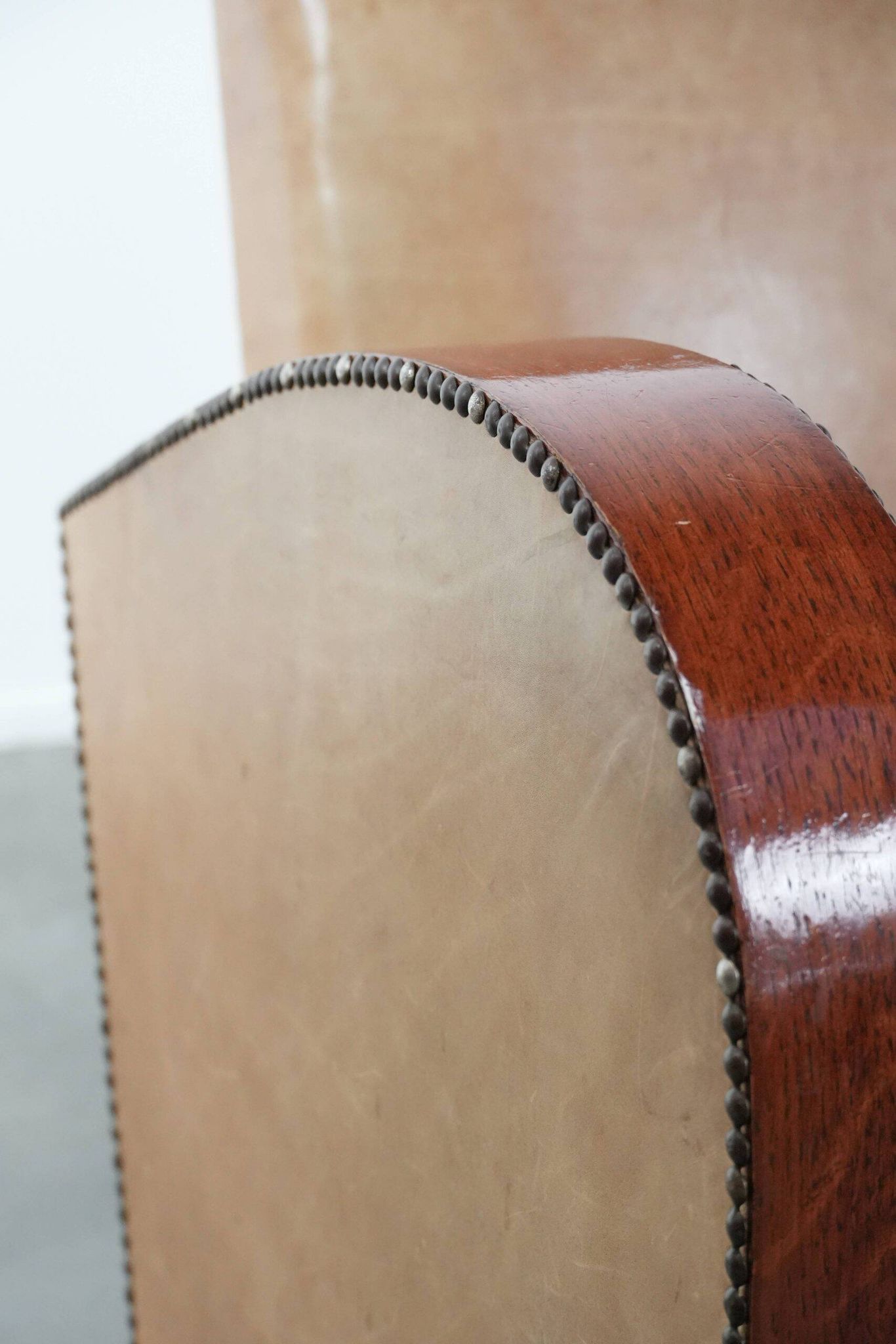 Art Deco design armchair in light cognac cowhide leather.