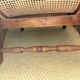Colonial planter's armchair in solid teak, scroll armrests, caned seat.