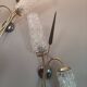 Set of 2 vintage 2-spoke wall lamps in gilded metal and diamond textured tulip glass