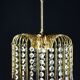 Suspension with tassels drops of water an glass