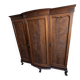 Large English-style wardrobe with a curved front and three doors.